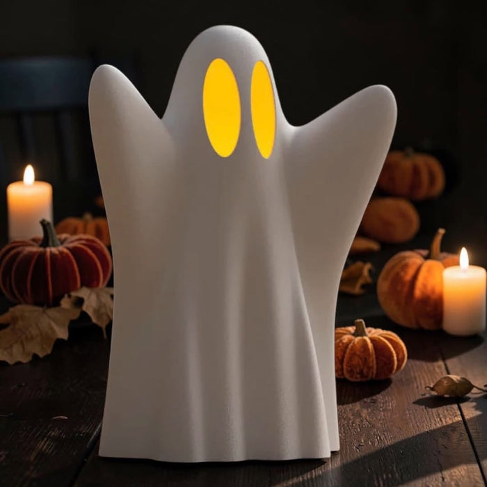 Matte white 3D printed ghost votive holder glowing with an LED candle, Halloween decor