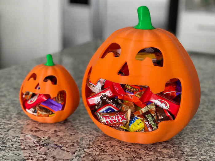 Grinning jack-o'-lantern candy bowl, 3D printed in orange PLA, Halloween treat holder