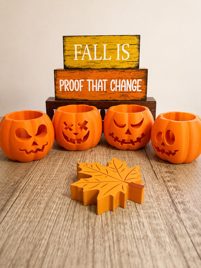 Set of four mini jack-o'-lantern votive holders with LED candles, 3D printed Halloween decor