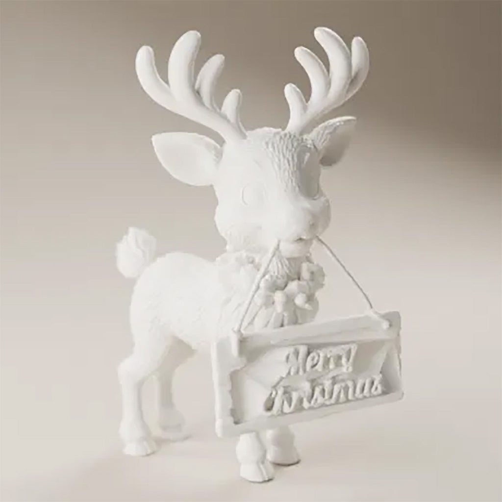 Unpainted 3D printed reindeer figure with a holly wreath, holding a Merry Christmas sign by a rope in his mouth