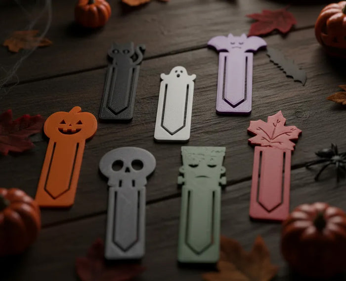 Set of seven 3D printed Halloween bookmark clips: pumpkin, cat, ghost, bat, skull, Frankenstein and maple leaf
